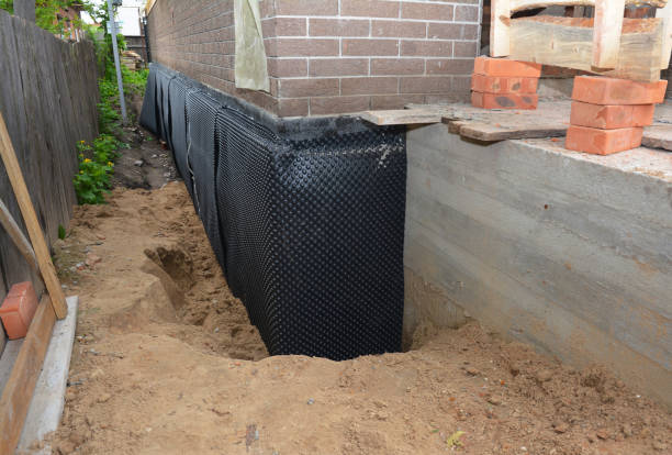 Happy homeowners after waterproofing job in Brooklyn